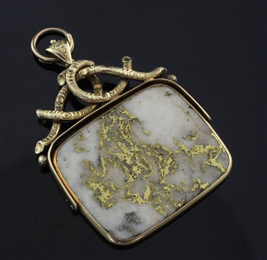 A gold mounted gold veined white quartz spinning fob, overall 2.25in.